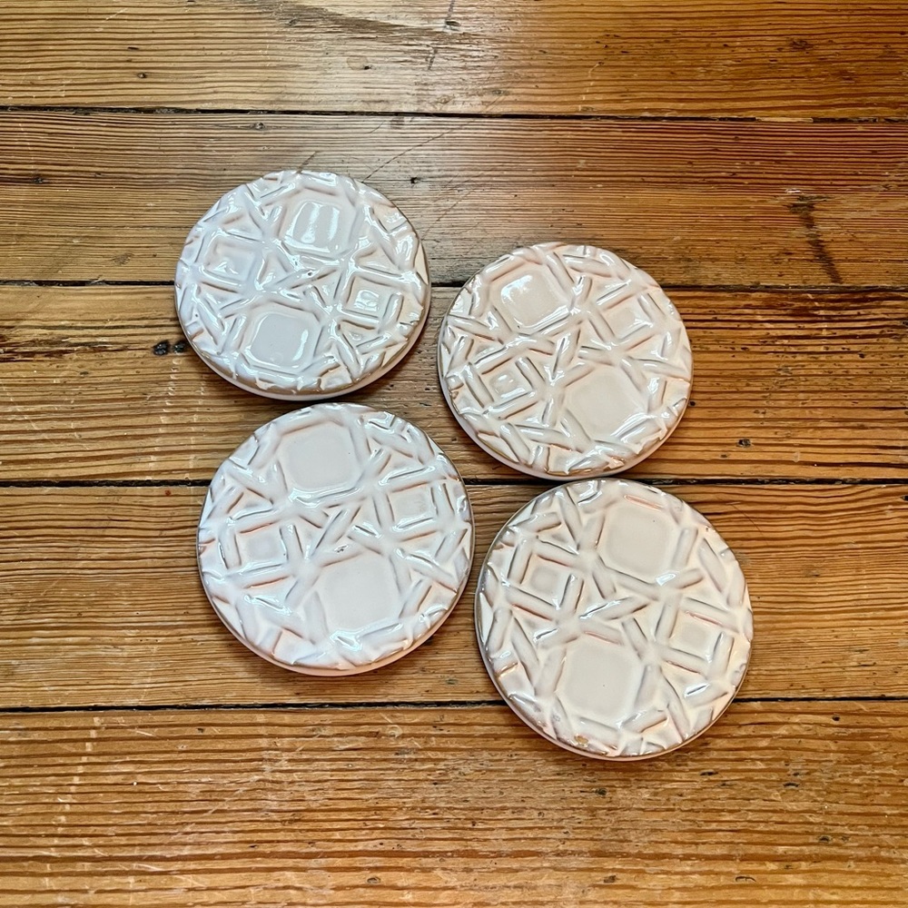 Set of white ceramic coasters